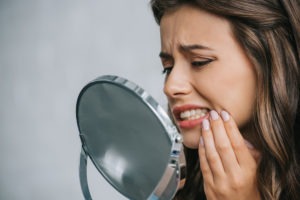 Gum recession can mean exposed teeth roots and painful symptoms.